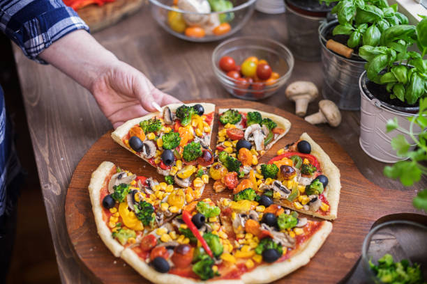 istock Vegetarian Pizza with Broccoli, Cherry Tomato, Pepper and Mushrooms 1297290781