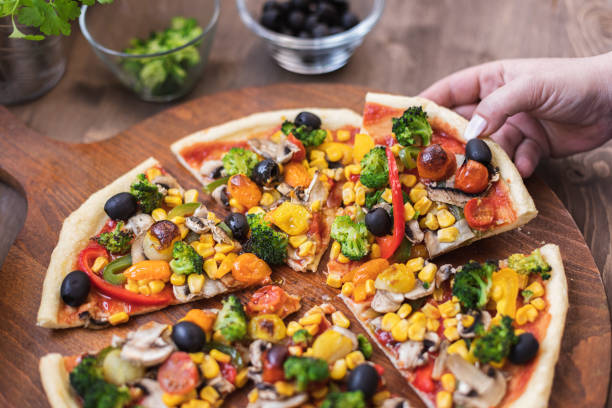 istock Vegetarian Pizza with Broccoli, Cherry Tomato, Pepper and Mushrooms 1297290811