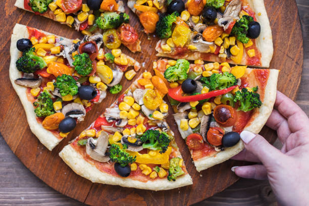 istock Vegetarian Pizza with Broccoli, Cherry Tomato, Pepper and Mushrooms 1297290964
