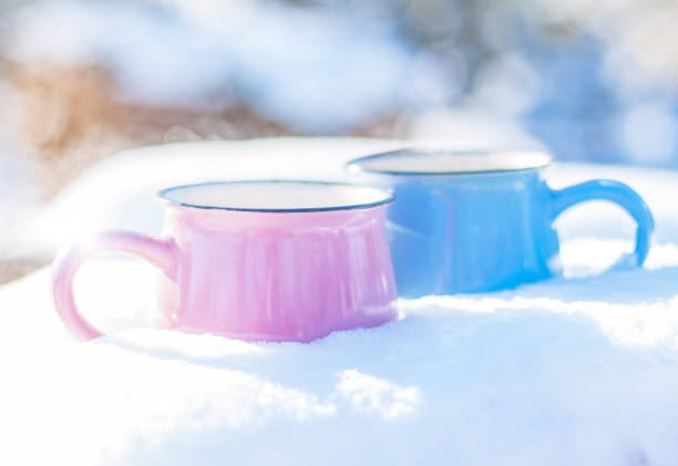istock cups with a hot drink stand  in the snow 1297291273