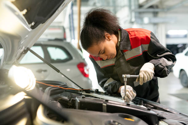 istock Professional technician of car repair service using tool to fix small details 1297291904