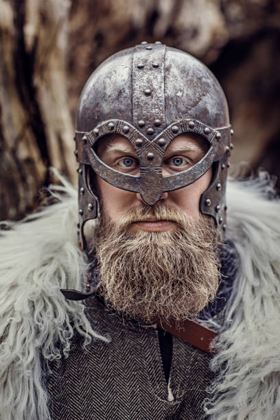 istock Headshot of a handsome viking warrior in a forest 1297292385