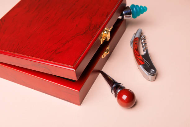 istock Wine corks and bottle openers set in a wooden box. 1297293550