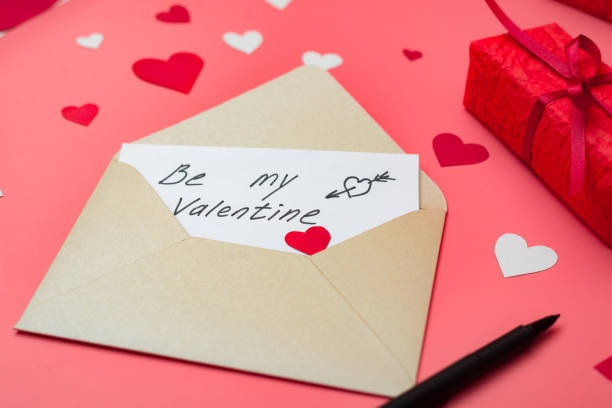 istock Be my Valentine - love letter on a red background with hearts. 1297293665