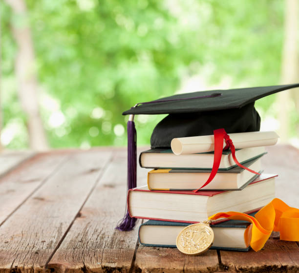 istock Graduation Cap and Diploma Concept 1297294612