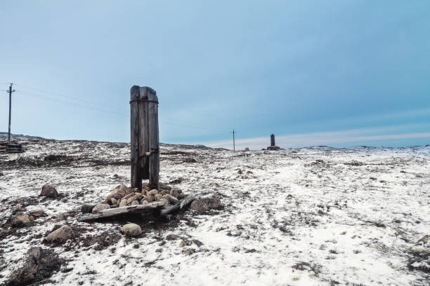 istock A broken telegraph pole on a snow-covered Arctic hill. Minimalistic polar landscape. 1297296017