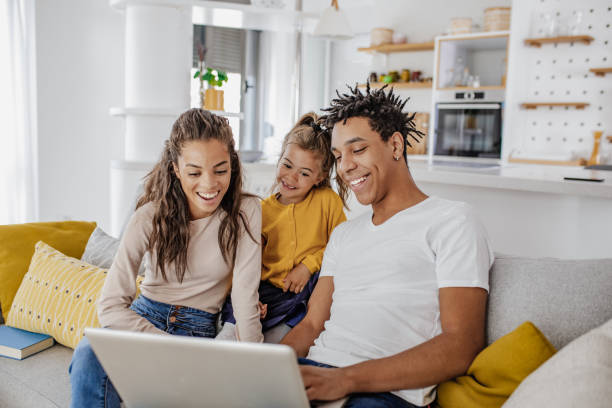 istock Young multi ethnic family is using laptop at home 1297297840