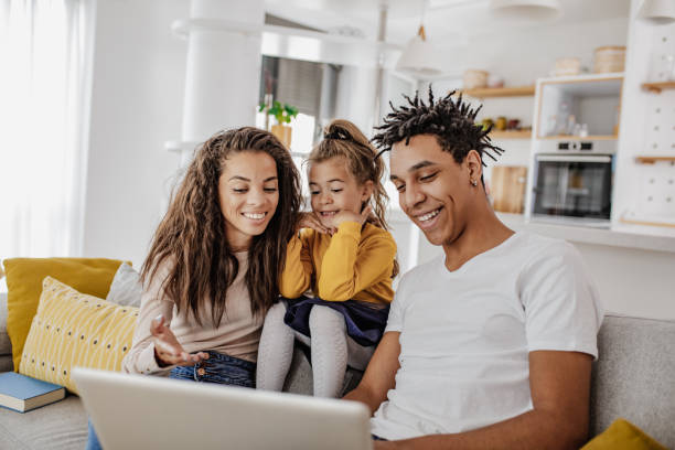 istock Young multi ethnic family is using laptop at home 1297298533