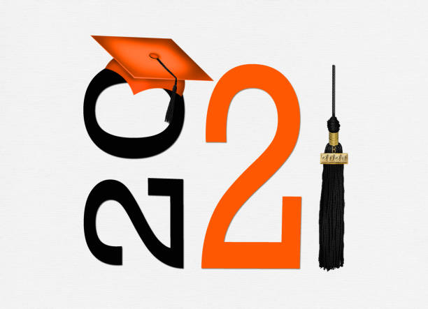 istock orange graduation cap with black tassel 1297298801