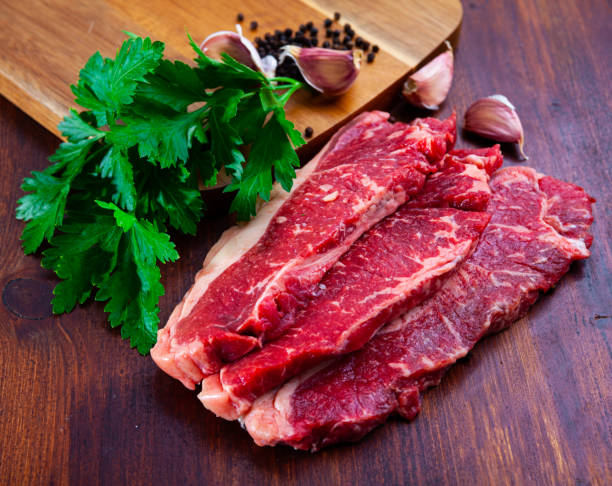 istock Raw marbled beef entrecotes with parsley and spices 1297299265