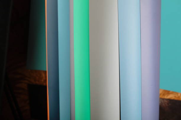 istock Rolls of color paper. Paper backdrops on a roll. 1297301701
