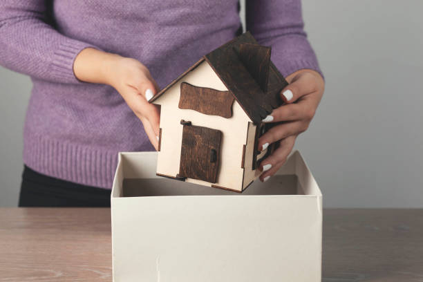 istock woman hand holding white box 1297304302