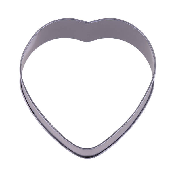 istock Heart cake form isolated on white background, copy space. Cake cup, metal mold, bakeware. Top view, flat lay, above 1297304958