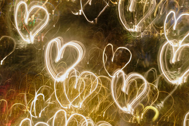 istock Abstract ICM:  Christmas tree lights produce heart-shaped light trails 1297305258