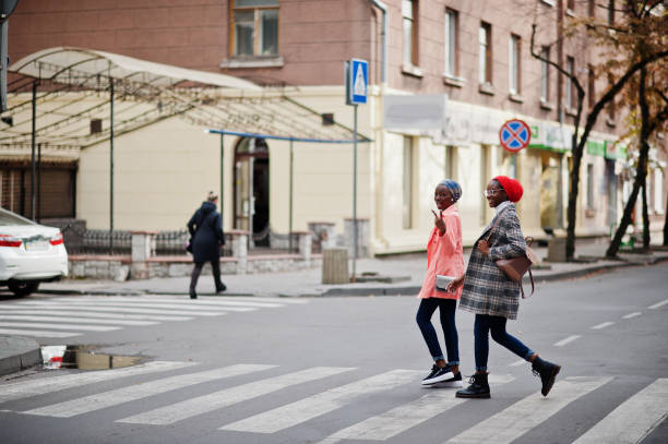 istock Two young modern fashionable, attractive, tall and slim african muslim womans 1297307607