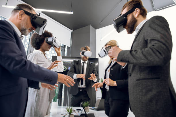 istock Group of five multiethnic people working with virtual reality glasses in modern office. New technology, 3d visualization, startup, future, architecture and design concept 1297309578