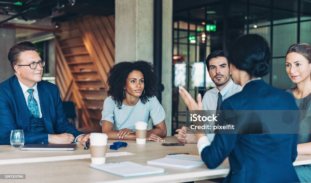 Company management on a meeting Multi-ethnic group of business persons discussing business Office Stock Photo