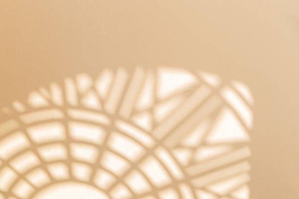 istock Abstract geometric shadows on yellow natural material wall 1297312943
