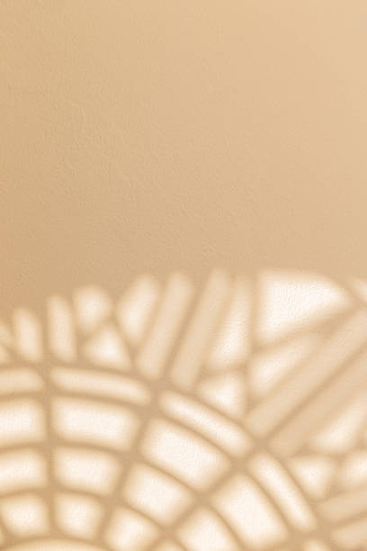 istock Abstract geometric shadows on yellow natural material wall 1297312948