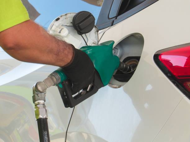 Supply of vehicle with gasoline or fuel ethanol. Employee filling the vehicle with Ethanol fuel. ethanol photos stock pictures, royalty-free photos & images
