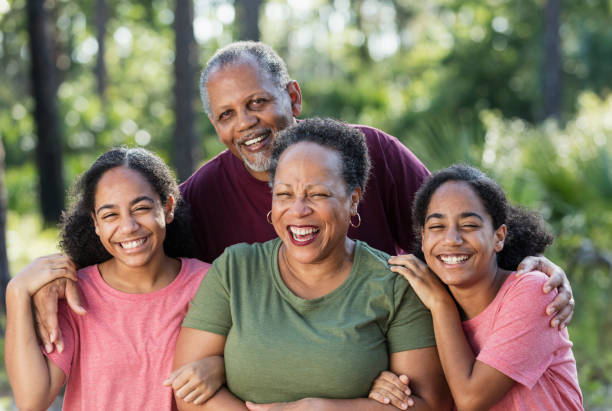istock Identical twin sisters with their grandparents 1297314002