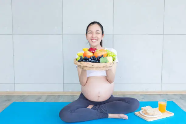 Photo of The pregnant mother is showing food and fruit to nourish the pregnancy.