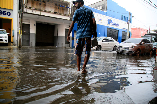 salvador, bahia, brazil - january 19, 2021: flooded street due to rain in the Calcada neighborhood, Cidade Baixa region in Salvador.