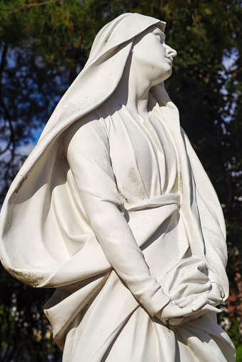 Beautiful statue of the Virgin Mary with a billowing veil.