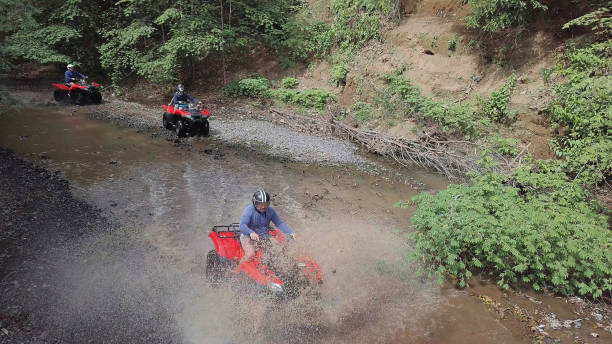 istock Driving quad bikes vehicles drone point of view 1297320040