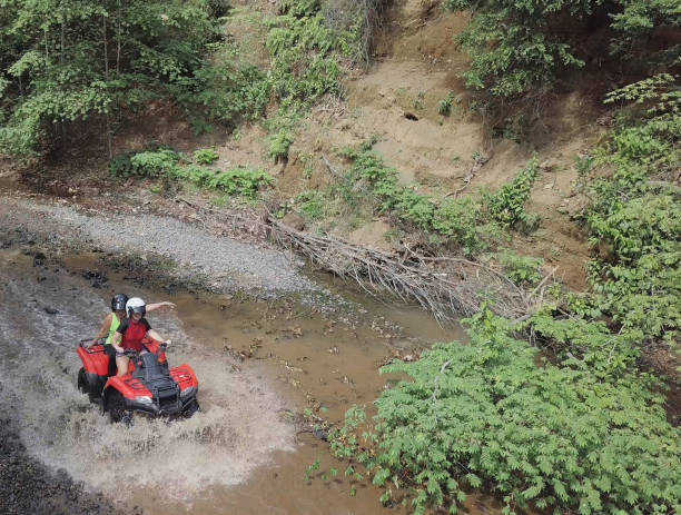 istock Driving quad bikes vehicles drone point of view 1297320086