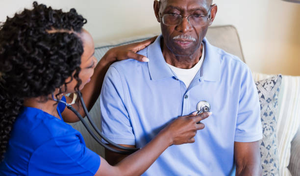 istock Nurse examining senior with stethoscope 1297322886
