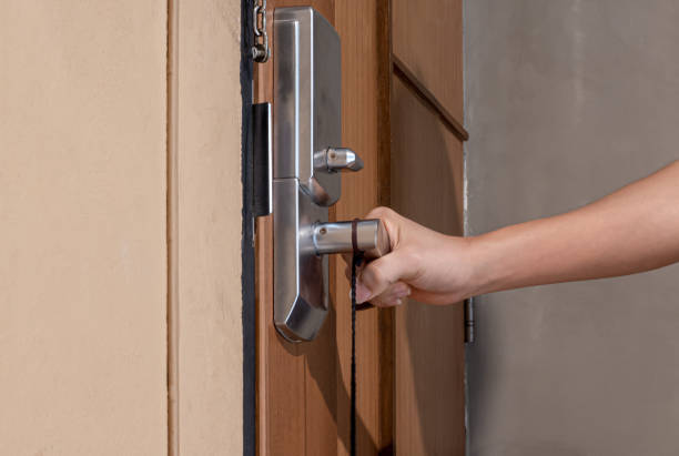 istock Man hand is about to open the door, closeup. Interior design 1297323081