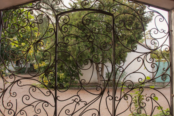 istock Landscape seen from an ancient wrought iron gate 1297326370