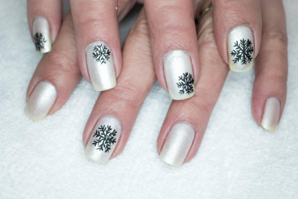 istock Black Snowflake Nail Art Design 1297329230