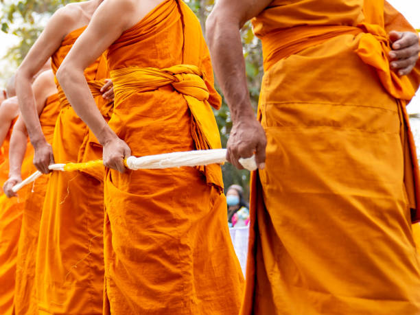 istock Monks holding holy thread in ceremony tradition of buddhist 1297330396