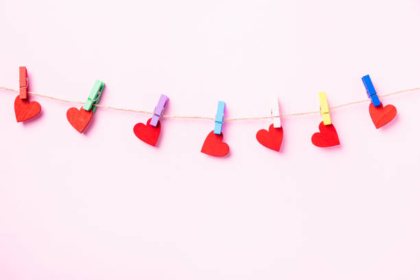 istock red heart-shaped valentines decoration hanging with wood clips 1297330554