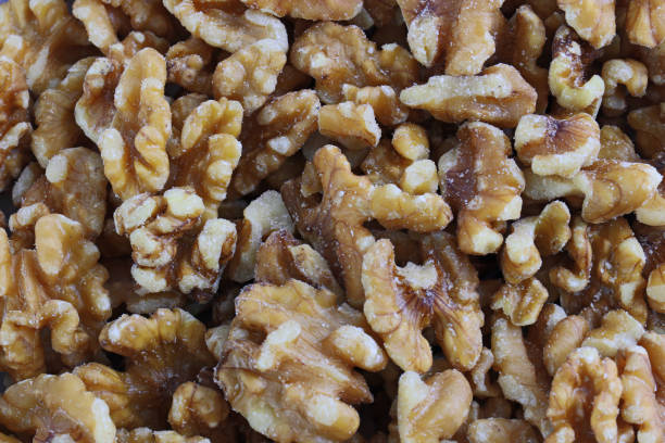 istock a pile of Walnut for background 1297331481