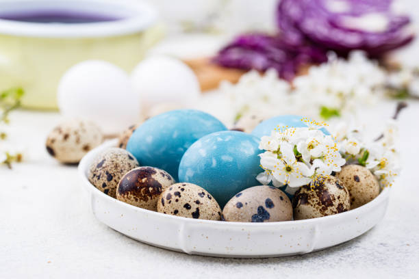 istock Process of painting Easter eggs in blue 1297331635
