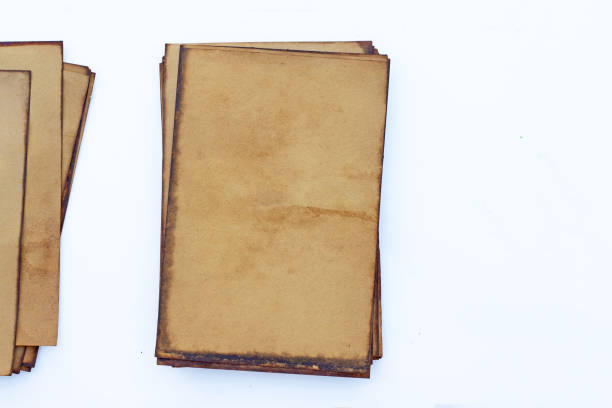 istock Pile of old brown paper for background. 1297333139