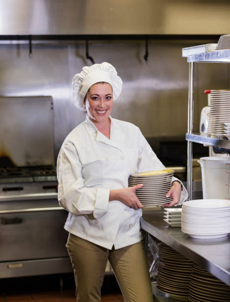 istock Hispanic female chef in restaurant kitchen 1297334566