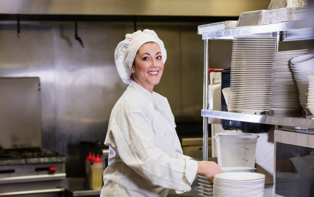 istock Hispanic female chef in restaurant kitchen 1297334572