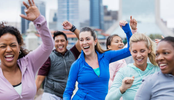 istock Hispanic woman in group dance class 1297334717