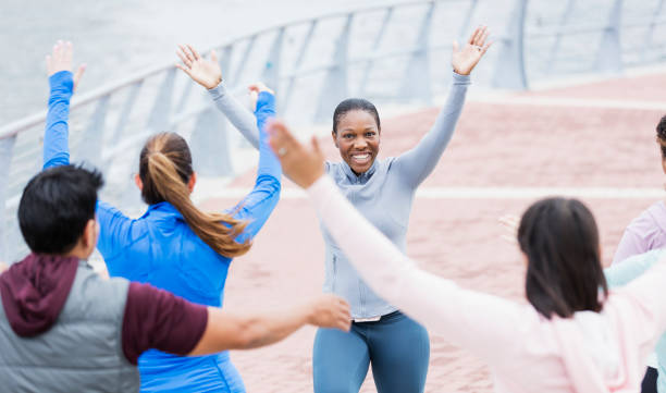 istock African-American woman leading dance exercise class 1297335316