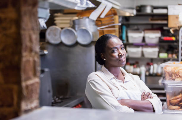 istock African-American woman working in restaurant kitchen 1297335449