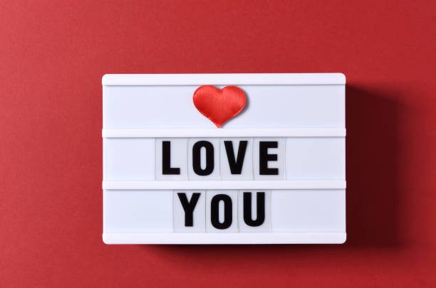 istock Love Text And Red Heart Shape on White Light Box 1297339862