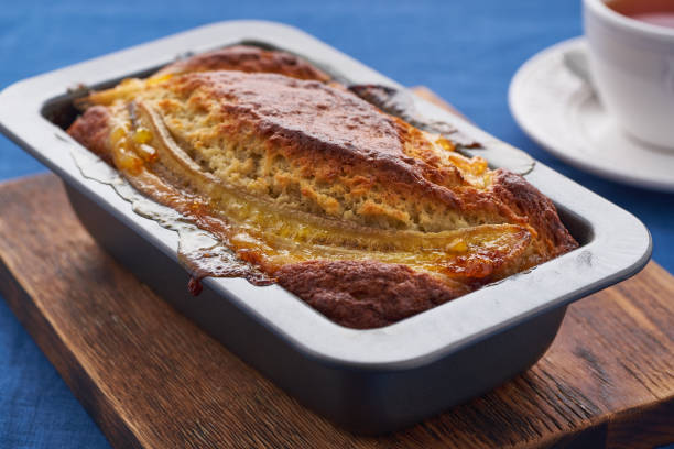 istock Banana bread, cake with banana. Whole loaf in pan 1297340556