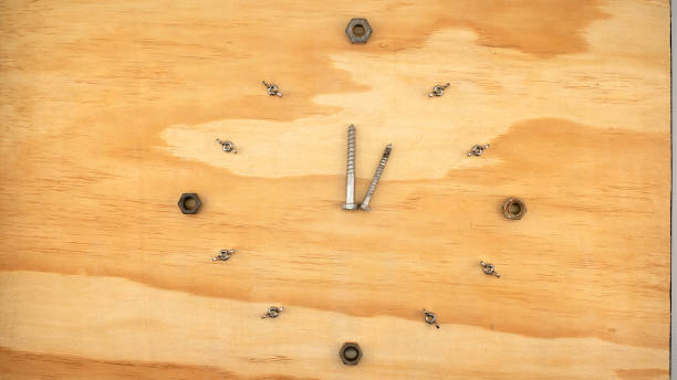 istock A clock made of bolts, wing nuts and screws 1297342428
