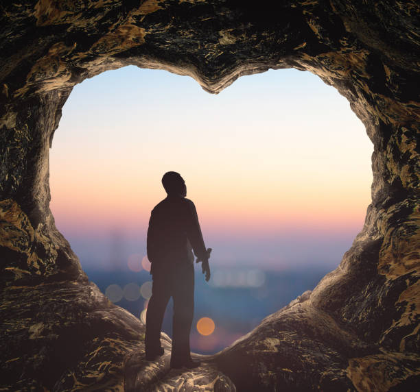 istock Alone man standing on cave of heart 1297344107