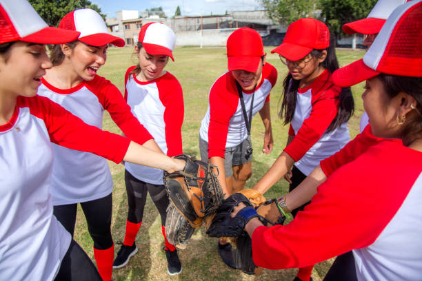 istock femenil baseball team celebrating 1297346906