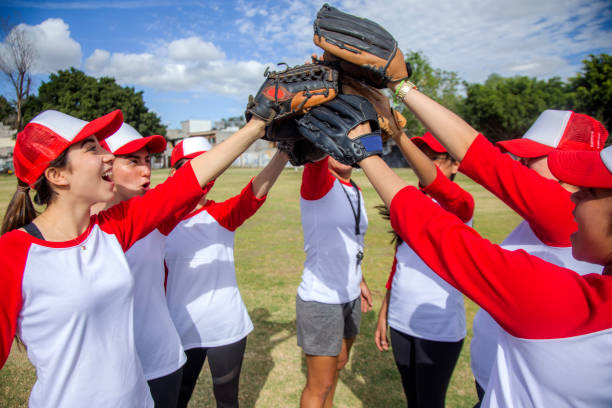 istock femenil baseball team celebrating 1297347518